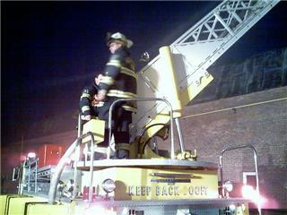 Assistant Chief Jason Simmons operates on the old Ladder 104.